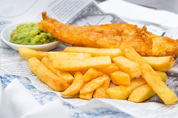  Fish and Chips with mushy peas served in the Pub
