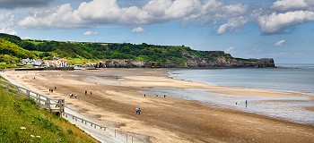 Panorama of Sandsend fishing village and dog friendly Sandsend beach on the North Sea North York Moors National Park England